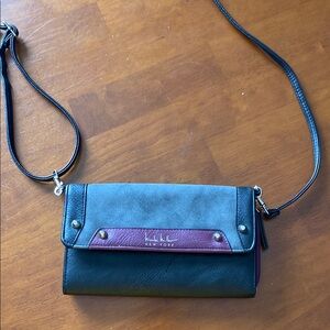 Nicole Miller Black and Purple Crossbody Bag with Flap Closure